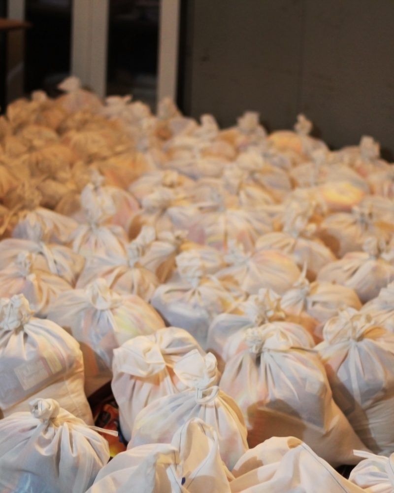 Rows of tied grocery bags, packed and ready to hand out