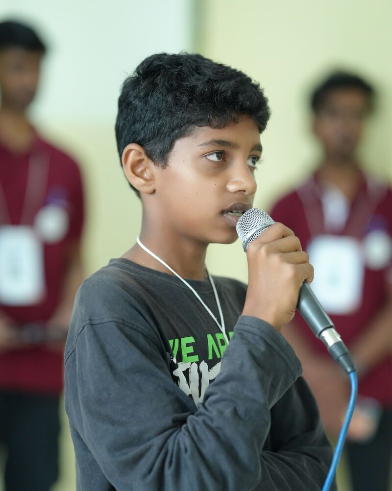 A boy singing into a microphone